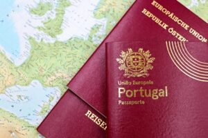 Close-up of Portuguese and Austrian passports lying on a map of Europe, symbolizing travel and mobility.